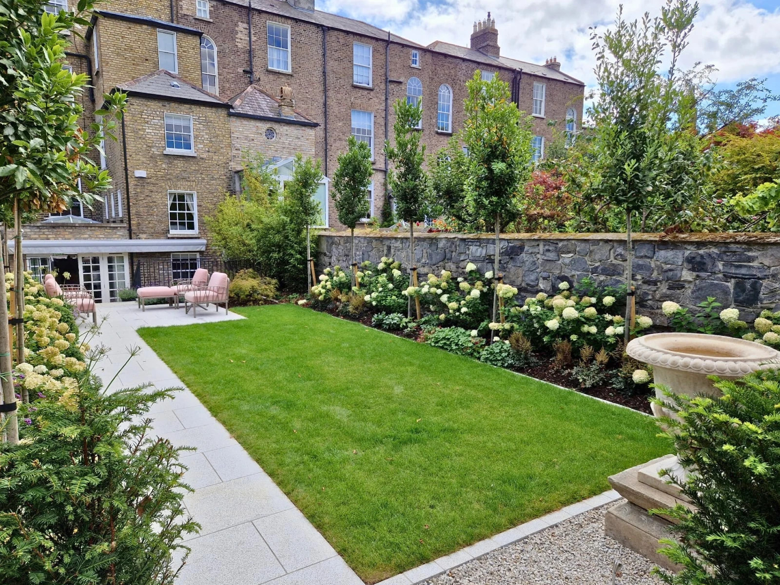 Standard bay trees planted to create privacy in a landscaped garden in Ballsbridge, Dublin.